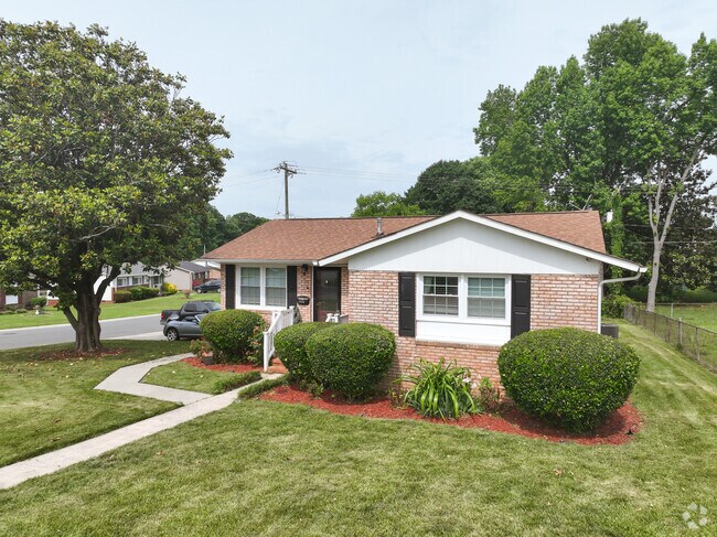 A ranch home in University Park with updated paint and freshened up landscaping.
