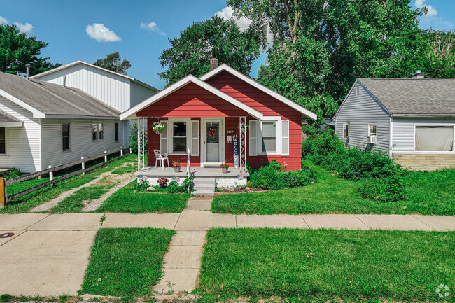 A little red bungalow gives a sleepy street a pop of bold color, in Fairlawn.