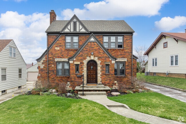 This North Anthony Tudor revival features a mix of brick and stone.