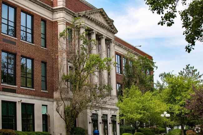 The Wyoming Middle School has large columns and detailed architecture.