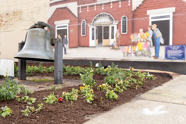 Downtown Suffolk’s historic bell and vibrant City Market mural reflect local heritage.