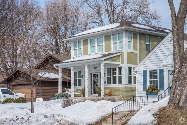 A foursquare style home with an exposed porch in the Kenny neighborhood.