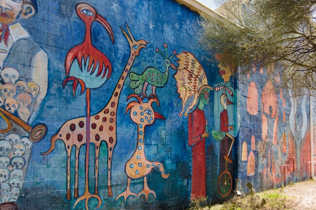All Souls Procession by Susan Kay Johnson is a vivid, quirky mural in Dunbar Spring.