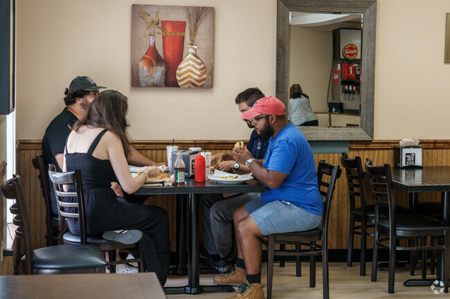 Locals enjoy pizza together in Pomeroy.