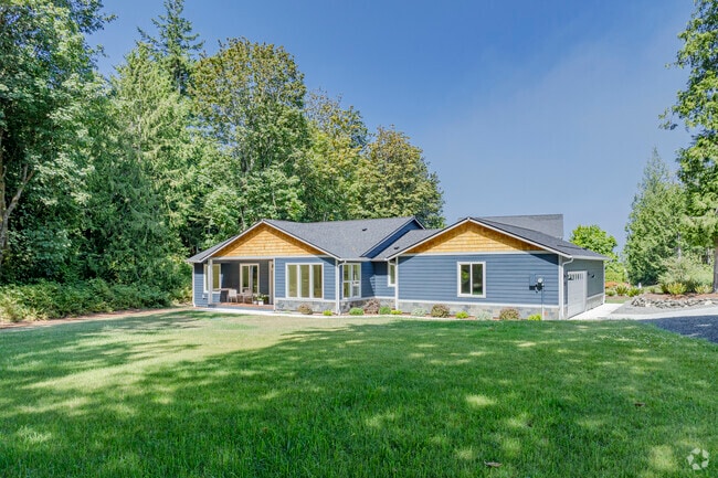 Tree-covered modern ranch-style homes are a common sight in Hansville, Washington.