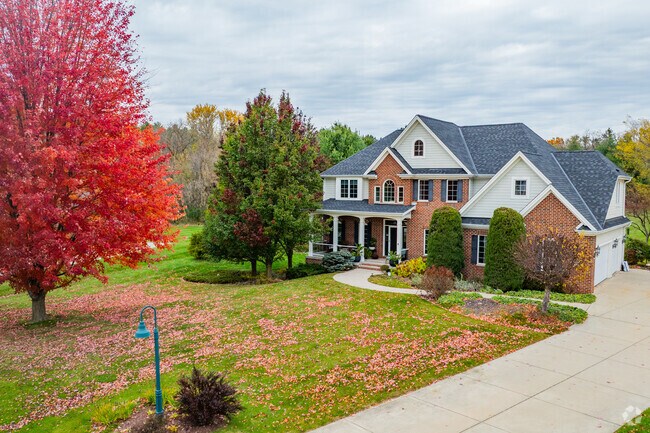 North Prairie homes with brick facades and columns reflect New Traditional and Colonia Revival-inspired architectural styles.