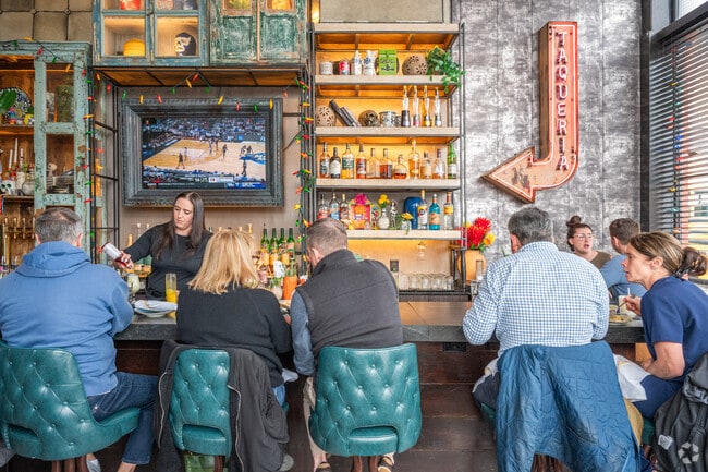 Hillside Street residents relax after a long week at the office with a drink from Yellow Door Taqueria.