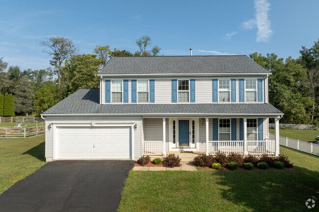 Enjoy quiet family living in a classic two-story colonial revival property.
