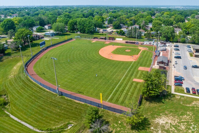 Young athletes at Urbandale High School practice on their sports fields.