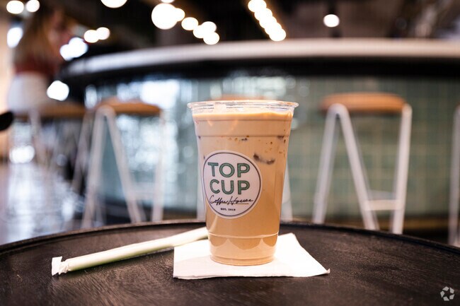 While in Sun Groves, grab a delicious iced coffee at Top Cup Coffeehouse to keep you going.