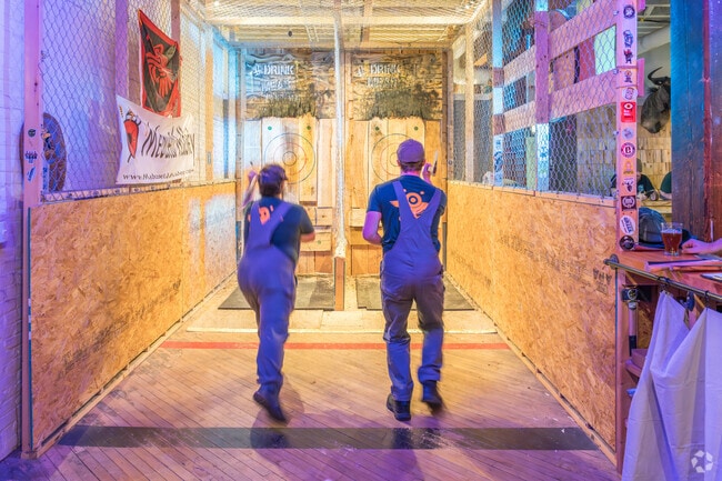 Axe throwing at Meduseld draws lively competition in Lancaster's Stadium District.