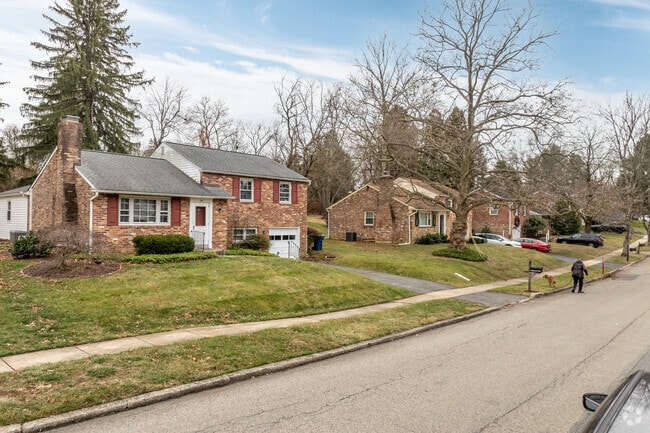 A row or posit-level homes lines this tidy street in the peaceful Devon neighborhood.