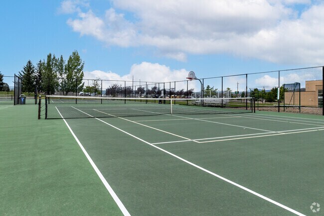 Green tennis courts are fenced in at South Summit Middle School.