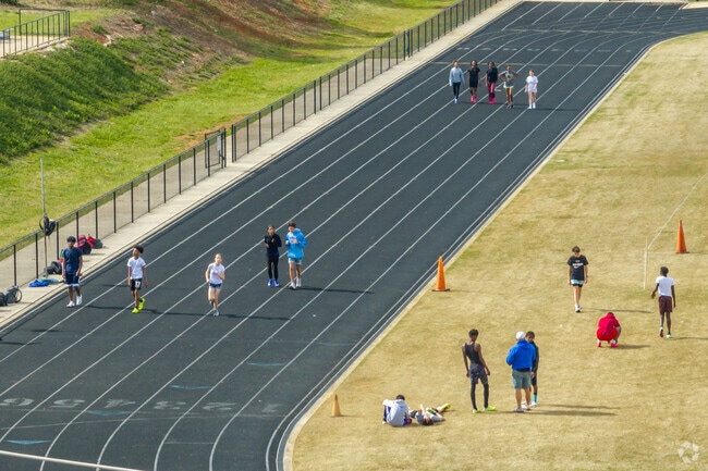 Students practice running track at the W.C. Sullivan Middle School in Rock Hill.