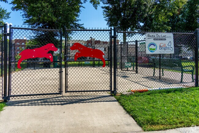 Enjoy the nearby nature trails at Bark Du Lac Dog Park for an evening hike.