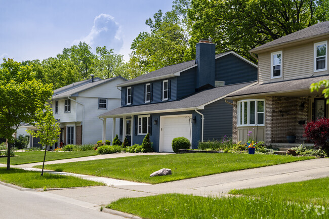 Colonials in Vernon Downs line a quiet street that dead ends at Dicken Woods Nature Area.