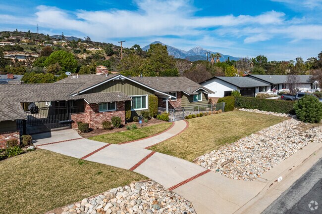 North Claremont homes offer spacious lots, tree-lined streets, and stunning mountain views.