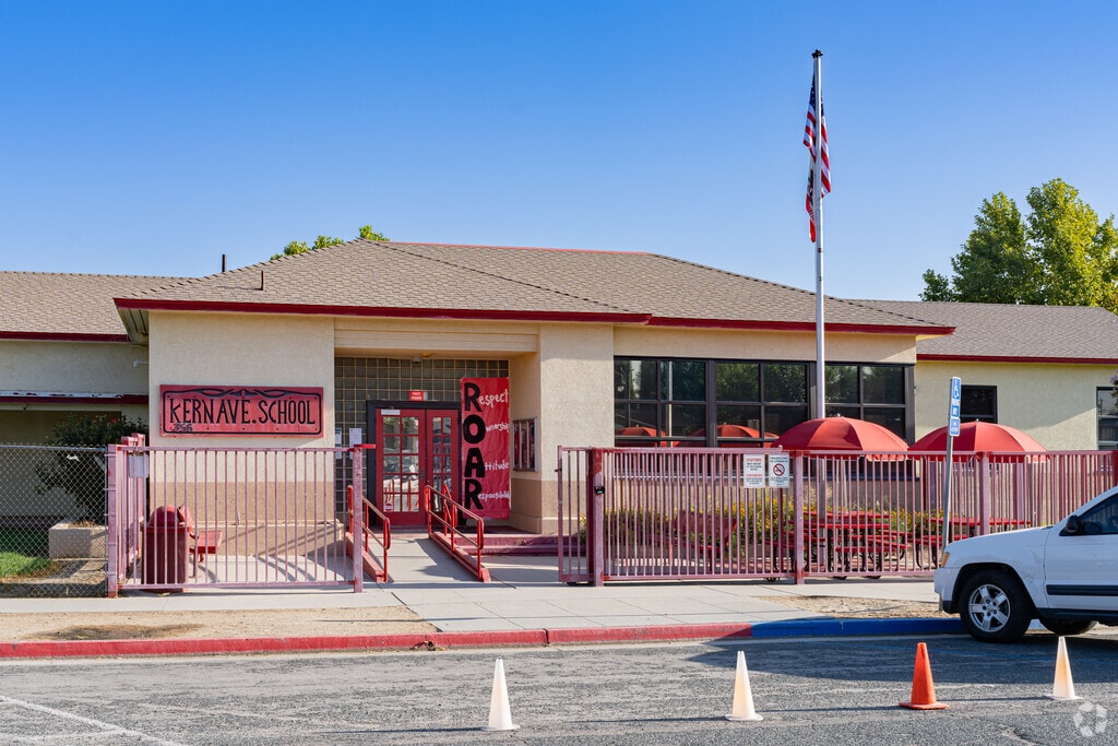 An American flag waves at the entrance to Kern Avenue School in McFarland.