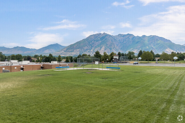 A green sports field with mountain views at Ridgecrest Elementary School.