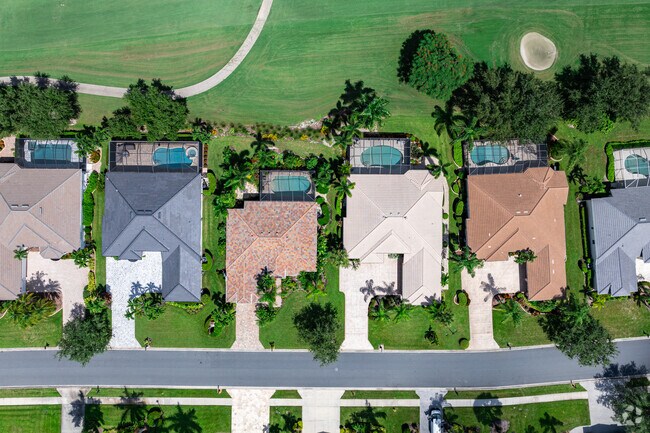 Single-family homes in Heritage Palms feature private swimming pools and views of the course.