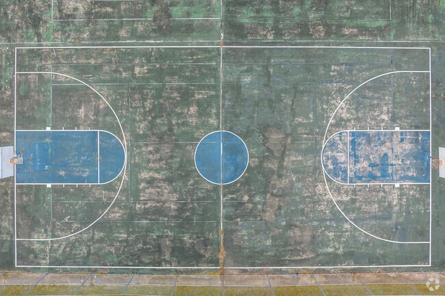 A well-used basketball court invites Weston Park visitors to shoot hoops.