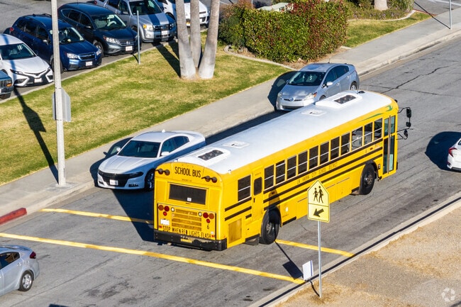 A school bus drives up to Ladera Palma Elementary in La Habra City.