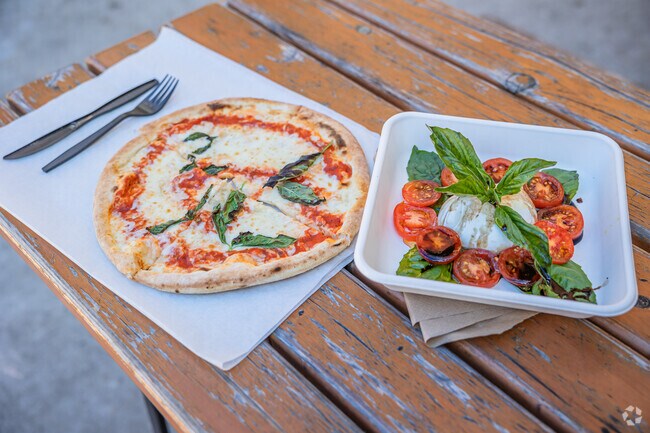 Eat a traditional Margherita pizza or a Caprese salad at Cugino Forno in Innovation Quarter.