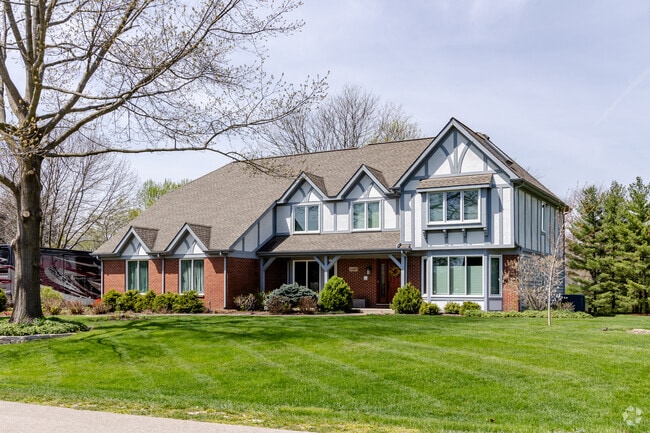 Located in Winfield a home with a Tudor-influenced style costs approximately $875,000.