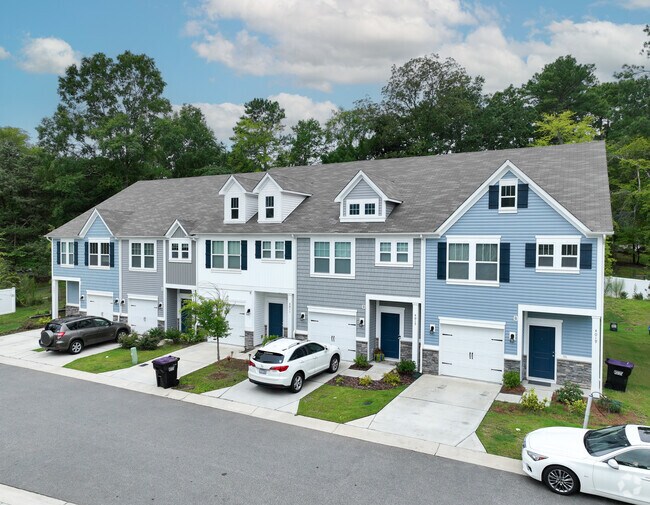 Townhomes in University City North features a garage for one car and a driveway.