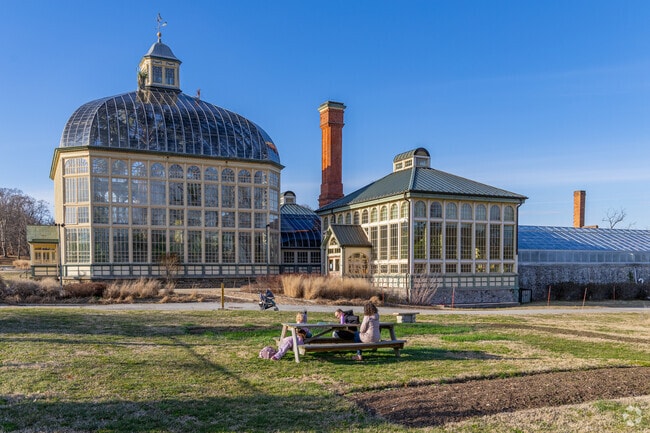 Relax on the benches and enjoy the green space at Rawlings Conservatory.