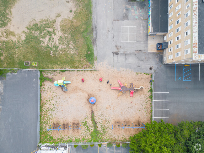 Lincoln Elementary Community  School playground has many activities for kids on the playground.
