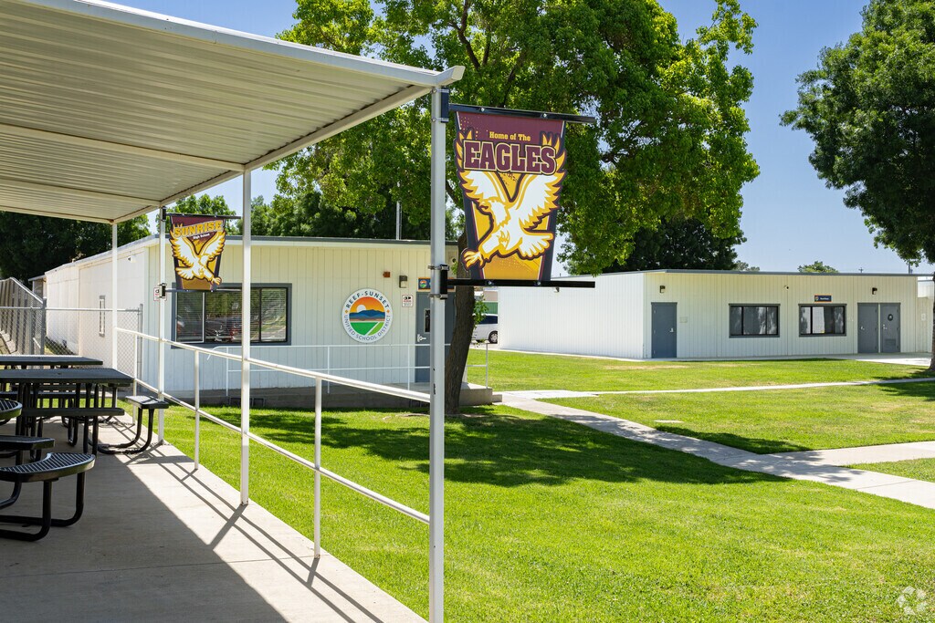 Mascot banners are displayed on the campus of Sunrise High School in Avenal.