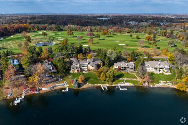 Waterfront homes in Orchard Lake Village feature expansive lots, soaring ceilings, and resort-style amenities.