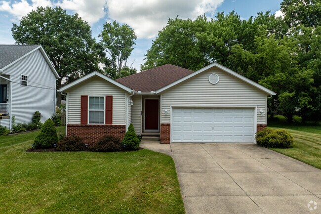 A ranch-style home with an attached garage located in Munroe Falls.