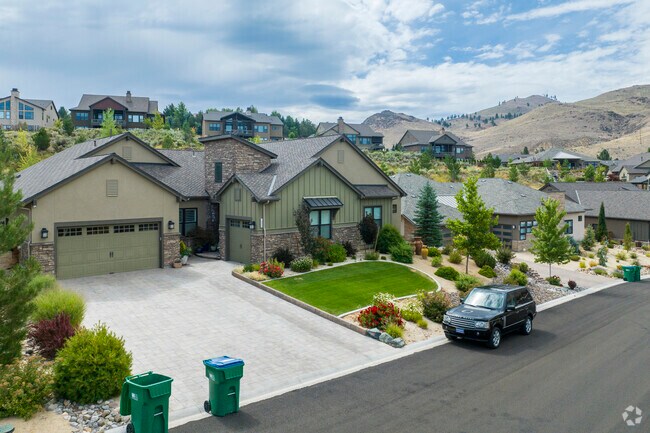 Most homes in Juniper Trails have garages and lush front yards.