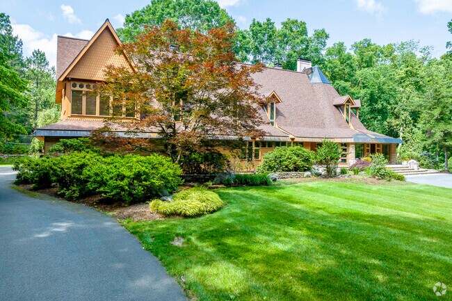 Contemporary estate hidden behind landscaping on Sears Road in Greater Southborough.
