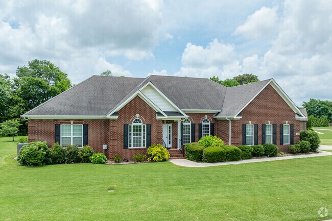 Red brick style traditional homes have well manicured lawns around Fairview-Skinem.