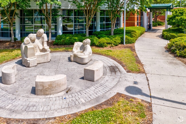 A small marble statue sits outside the Norview Community Center in Greenhill Farms.