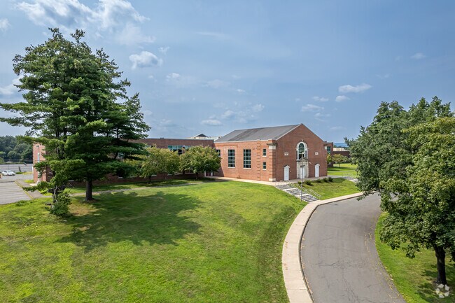 Morning light hits Granby Memorial High, where Hartland students begin their day.