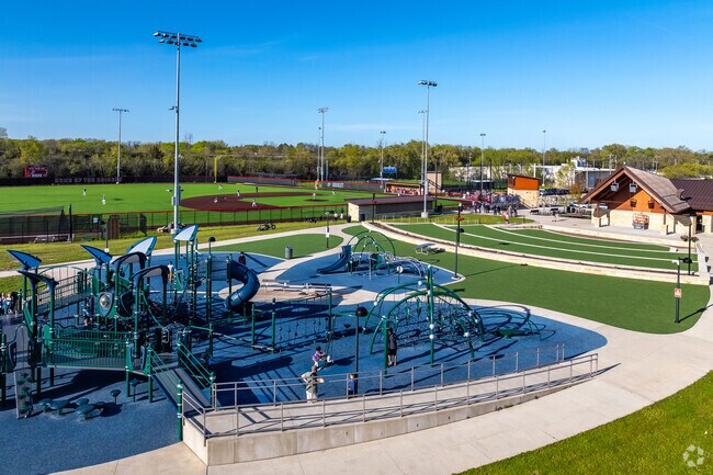 The playground at Maslowski Glendale Community Park is busy each summer evening.