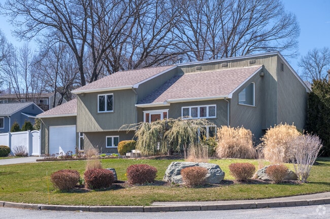 Landscaping in Front of a Modern Home Gives an Elegant Touch to the Street