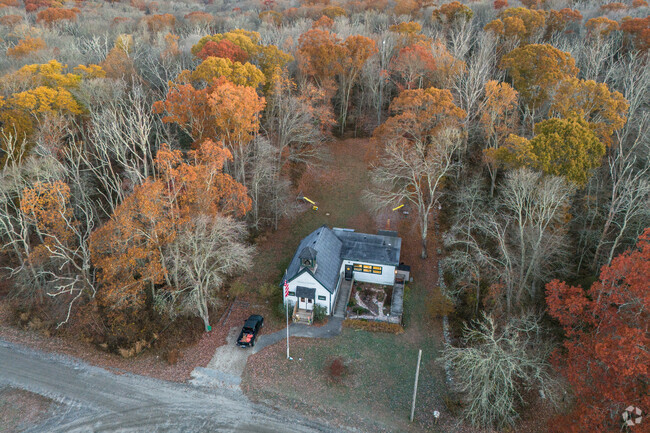Prudence Island School has a cleared play and sports area, with adjacent forest trails.