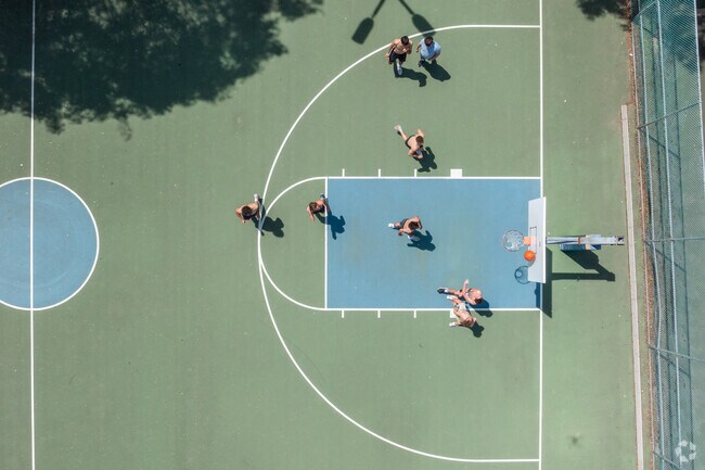 The boys play pickup basketball at Narberth Park.