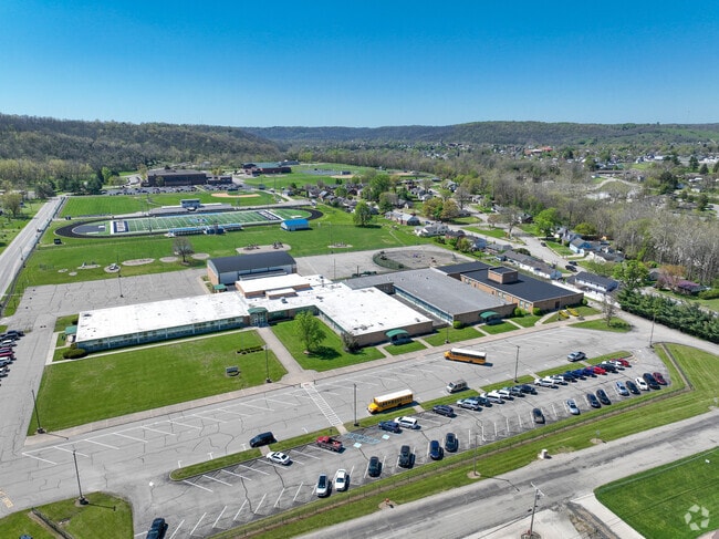 The large football stadium is located in the back of the elementary building.