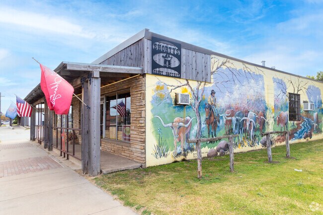 The artsy exterior wall of Shorty's Caboy Hattery.
