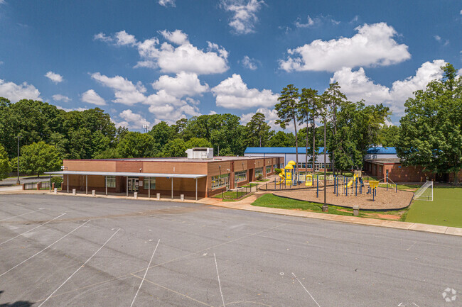 Billingsville Cotswold Elementary School has a large parking lot in the back of the school.