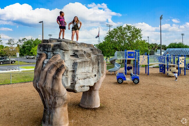 The playground at Buckingham Community Park includes rock sculptures for climbing.
