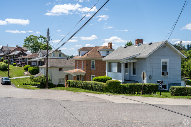 A row of homes in the Strabane neighborhood along a gently sloping street.