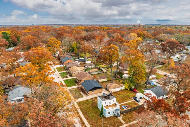 This street of smaller ranch homes look beautiful in the fall foliage.