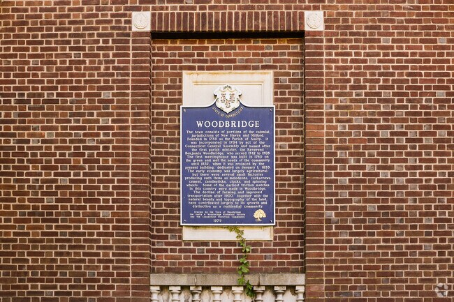 A plaque outside the Town Center gives a brief history of the Town of Woodbridge.